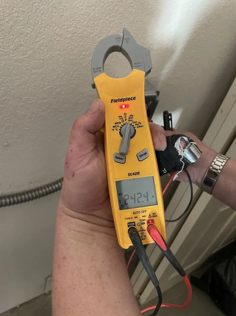 Voltage testing with clamp meter during Recessed Lighting Installation in Lakemoor